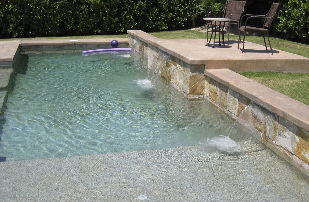 Pool waterfall feature and clean tiles in Diamond Bar, CA